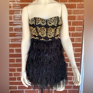 Size small Gianni Bini strapless party dress with feather skirt, black and gold